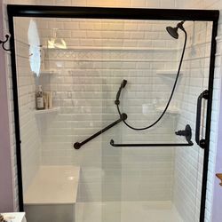 Re-Bath - Classic Subway Tile and Matte Black bypass door.
