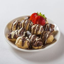 Build Your Own (BYO) mini pancakes with milk and white chocolate drizzle and strawberries