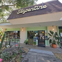 Exterior outside entrance of Serpentine Plants + Provisions - Front door and outdoor seating - Gainesville, Florida Exterior outside entrance of Serpentine Plants + Provisions - Front door and outdoor seating - Gainesville, Florida
