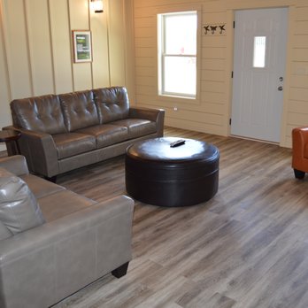 Hawkshead - a living room with leather furniture - Golf Near Me - South Haven, Michigan