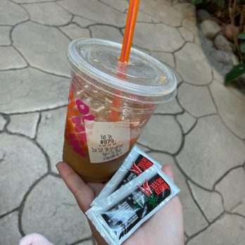 Dunkin' -  a person holding a drink and a condom - Donuts Near Me - Las Vegas, Nevada