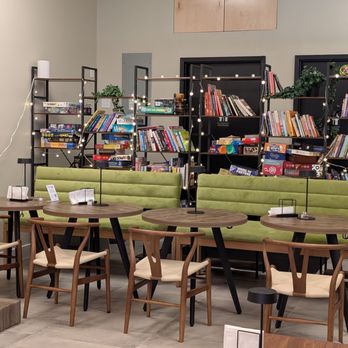 Momos Cafe - Another view of the bookcases that hold books, and games. - Coffee & Tea Near Me - Ardsley, New York