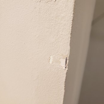 Benchmark Surfaces - BENCHMARK damaged the wall in the bathroom - Countertop Installation Near Me