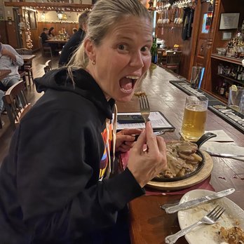 Nurnberger Bierhaus - Little potato pan was a huge portion came with pork & sizzling hot on iron pan. Mushroom Gravy was amazing - German Near Me - Lake Ariel, Pennsylvania