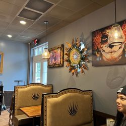 Casa Tequila Mexican Grill - Wall decor and Kay looking on the side.