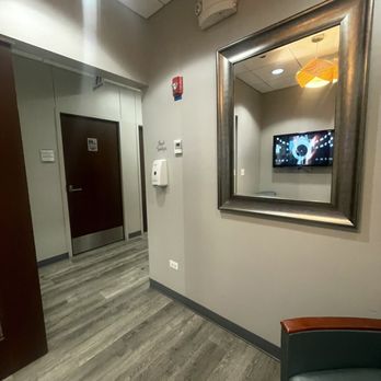 Bright Light Medical Imaging - A hallway with a small waiting area next to bathroom - Radiologists Near Me - Bedford Park, Illinois Bright Light Medical Imaging - A hallway with a small waiting area next to bathroom - Radiologists Near Me - Bedford Park, Illinois