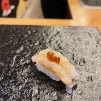 Kinzan Omakase - a close up of a piece of food - Sushi Bars Near Me - New York, New York Kinzan Omakase - a close up of a piece of food - Sushi Bars Near Me - New York, New York