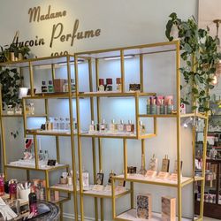 Madame Aucoin Perfume - Shelves with perfume bottles.