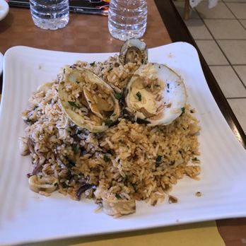 Machupicchu Restaurant - Arrow con marisco  See the 1 and only clam on top - Peruvian Near Me - Providence, Rhode Island
