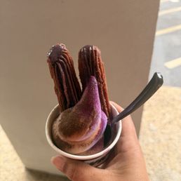 Ube flavored ice cream and churro