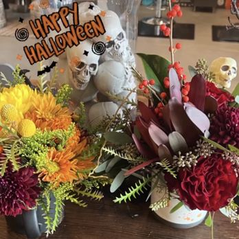Flowers By Melis - The 2 arrangements set in a Halloween display - Floral Designers Near Me