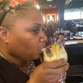 Deluxe Fun Dining - Diced Pineapple drink with gold - Bars Near Me - Charlotte, North Carolina Deluxe Fun Dining - Diced Pineapple drink with gold - Bars Near Me - Charlotte, North Carolina