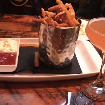 Union 50 - Truffle oil fries with garlic aioli and ketchup - drink: Daisy Fay - Gastropubs Near Me - Indianapolis, Indiana