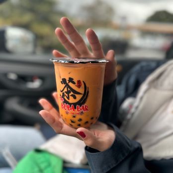 The Boba Bar - a woman holding a cup of boba - Coffee & Tea Near Me - Burbank, California The Boba Bar - a woman holding a cup of boba - Coffee & Tea Near Me - Burbank, California