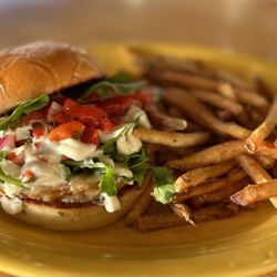 Butter Bar & Kitchen - House made veggie burger - sweet potato, chickpea, chipotle - with arugula, herb aioli and roasted red pepper salsa on brioche with fries.