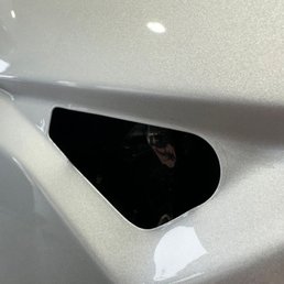 Cuts into the paint where the side cameras go.
