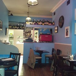 Kostas Greek Restaurant - Kitchen. Lots of tables in the front.