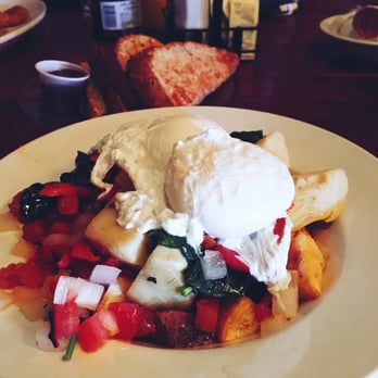 Beggar's Banquet - Poached eggs on top of roasted red peppers, spinach, artichokes, onions and home fries - Wine Bars Near Me - East Lansing, Michigan Beggar's Banquet - Poached eggs on top of roasted red peppers, spinach, artichokes, onions and home fries - Wine Bars Near Me - East Lansing, Michigan