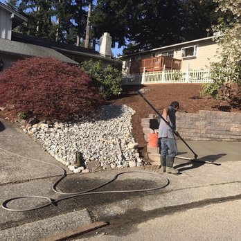 Edge Landscaping - After photo: Bellevue, new riverbed, river rock, aggregate concrete, excavation, clean up and new bark. - Landscaping Near Me Edge Landscaping - After photo: Bellevue, new riverbed, river rock, aggregate concrete, excavation, clean up and new bark. - Landscaping Near Me