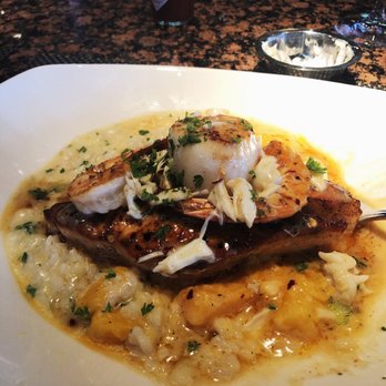 Pappadeaux Seafood Kitchen - Crispy Atlantic Salmon and scallop over Butternut Squash Risotto - Seafood Near Me - Arlington, Texas Pappadeaux Seafood Kitchen - Crispy Atlantic Salmon and scallop over Butternut Squash Risotto - Seafood Near Me - Arlington, Texas