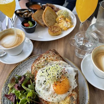 Madame - English breakfast, croique madame, cappuccinos and mimosas. Sooooo delish. Mimosas are made with freshly squeezed OJ! - Coffee & Tea Near Me - Geneva, GE