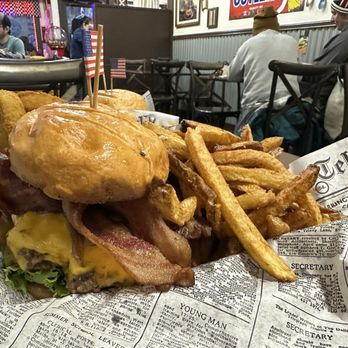 Penelope's World Famous Burgers & Fries - Before attempting to eat: regular fries, 2/3 pattie burger with added bacon (good amount of bacon!) & American cheese - American Near Me - Estes Park, Colorado Penelope's World Famous Burgers & Fries - Before attempting to eat: regular fries, 2/3 pattie burger with added bacon (good amount of bacon!) & American cheese - American Near Me - Estes Park, Colorado