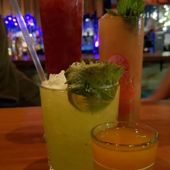 Navy Strength - All of our drinks together (Right to Roam tall left, 1934 Zombie tall right, Space Crush front left, Gnarly Disposition front right) - Tiki Bars Near Me - Seattle, Washington Navy Strength - All of our drinks together (Right to Roam tall left, 1934 Zombie tall right, Space Crush front left, Gnarly Disposition front right) - Tiki Bars Near Me - Seattle, Washington