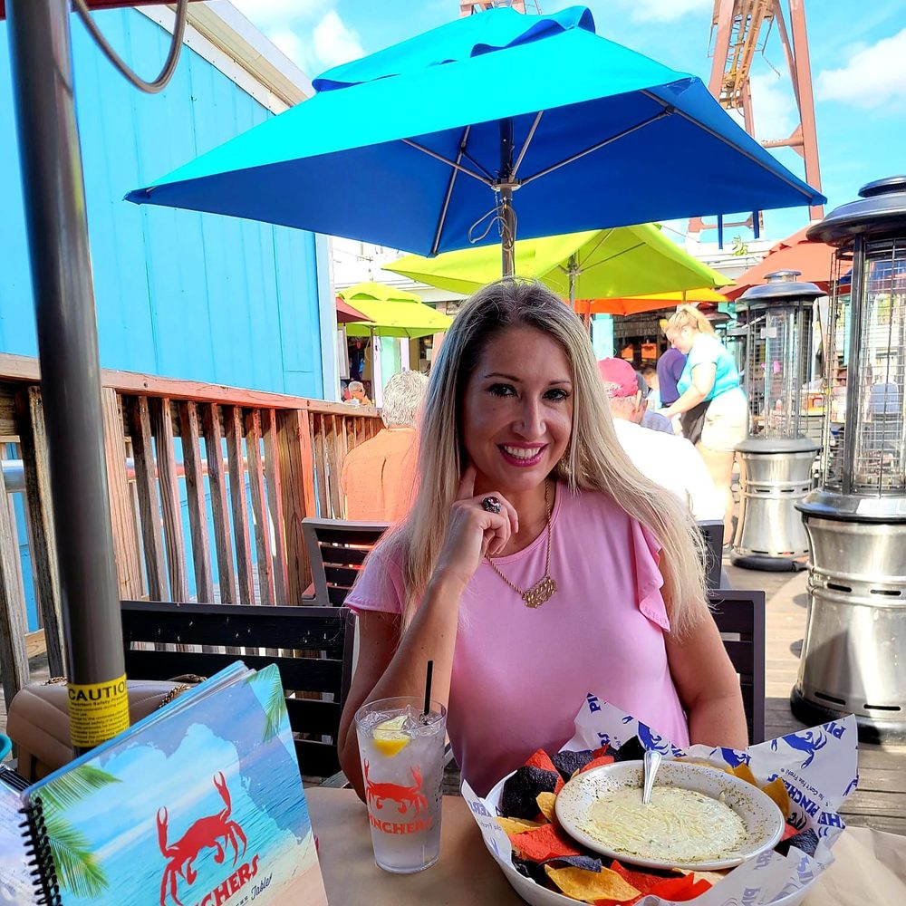 Pinchers - A happy diner eating Crab & Cheese dip - Seafood Near Me - Naples, Florida Pinchers - A happy diner eating Crab & Cheese dip - Seafood Near Me - Naples, Florida