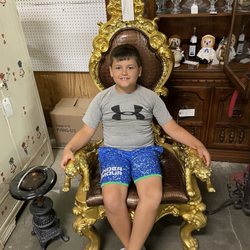 49 Flea Market - My handsome son sitting in a unique chair.