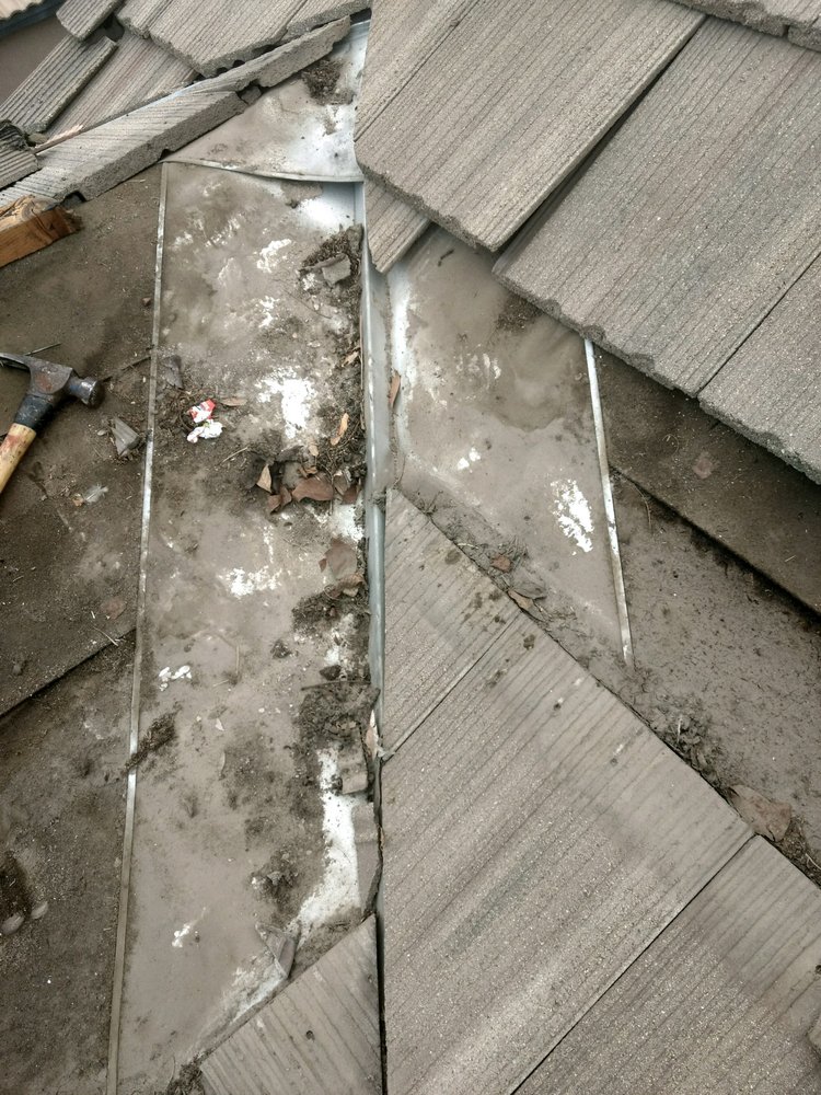 Slide of Magic Hands Roofing