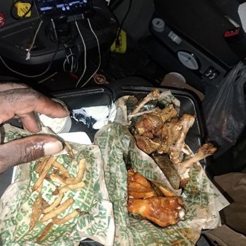 Wingstop - a man eating a meal in a car - Chicken Wings Near Me - Greeley, Colorado Wingstop - a man eating a meal in a car - Chicken Wings Near Me - Greeley, Colorado