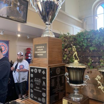 Cubs Den At Ballpark Synagogue - Championship trophies on display at the team store - Sports Wear Near Me - South Bend, Indiana Cubs Den At Ballpark Synagogue - Championship trophies on display at the team store - Sports Wear Near Me - South Bend, Indiana