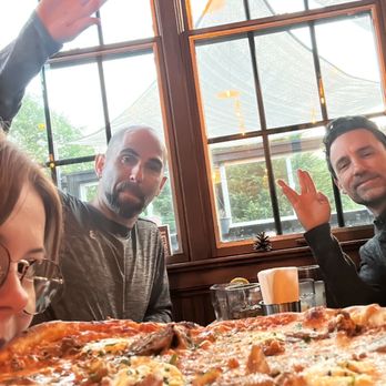 Steeplejack Pizza and Beer - Friends enjoying their pizza - Pizza Near Me - Portland, Oregon Steeplejack Pizza and Beer - Friends enjoying their pizza - Pizza Near Me - Portland, Oregon