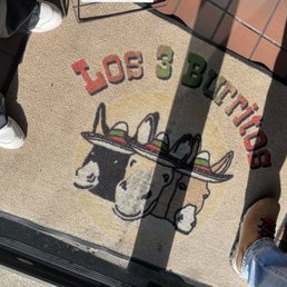 a person standing in front of a doormat