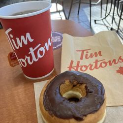 Tim Hortons - Chocolate dipped donut and cup of tea.