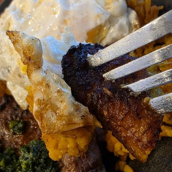 Inka Grill - Close-up of of the ripe, sweet, plantain and the fried egg. - Peruvian Near Me - Roanoke, Virginia Inka Grill - Close-up of of the ripe, sweet, plantain and the fried egg. - Peruvian Near Me - Roanoke, Virginia