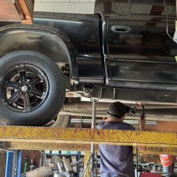 Muffler guy installing my new stock muffler Muffler guy installing my new stock muffler