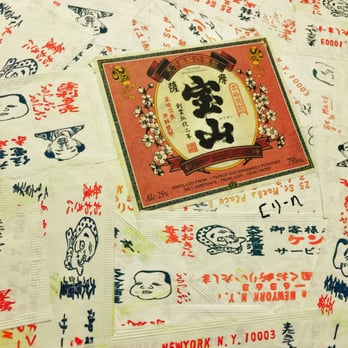 Kenka - Bathroom walls papered with chop stick wrappers - Sushi Bars Near Me - New York, New York