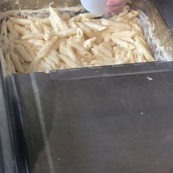 Beecher's Handmade Cheese - Mac and cheese.  It's already pre-made and is scooped out to customers. - Cheese Shops Near Me - Seattle, Washington