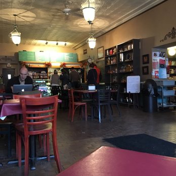 Common Ground Coffee House - a man working on his laptop - Coffee & Tea Near Me - Grand Rapids, Michigan