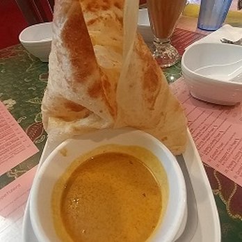 Layang Layang - Roti Canai-Homemade Indian style pancake with curry dipping sauce. - Malaysian Near Me - Milpitas, California Layang Layang - Roti Canai-Homemade Indian style pancake with curry dipping sauce. - Malaysian Near Me - Milpitas, California