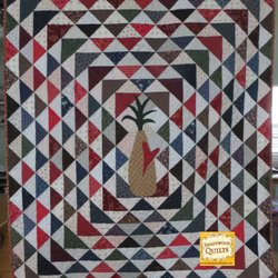 Shadywood Quilts - Custom quilting, custom piecing.  Half square triangle quilt with hand applique pineapple.
