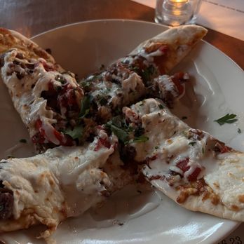 The Block - Daily flatbread special -- pulled beef short rib, fresh tomato sauce, mozzarella, beer braised onions, rosted peppers, blue cheese emulsion - New American Near Me - Webster Groves, Missouri