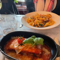 il Cavallino Italiaans Restaurant - Entrees: gluten-free pasta with clams (the special) and eggplant & cheese dish, like a lasagna without pasta. Both delicious!!
