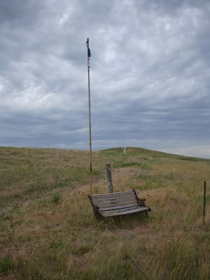 Photo of Re-Member Office - Pine Ridge, SD, US. That's what's left of a flag on the property that has been left out in the elements.