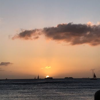 Photo of Barefoot Beach Cafe - Honolulu, HI, United States. Amazing sunset view from our table