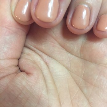 Lush  Nail Salon - 2 days post manicure. The red mark on the middle finger is the from the chunk of skin that was taken off during the manicure. - Nail Salons Near Me - Marietta, Georgia