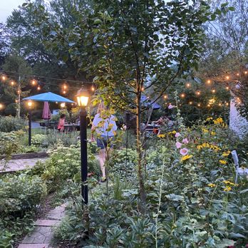 Cafe Gulistan - a woman walking through a garden - Middle Eastern Near Me - Harbert, Michigan