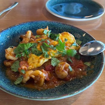 Cabra - Shrimp Tacu Tacu crispy rice cake, huancaina omelette - Peruvian Near Me - Chicago, Illinois Cabra - Shrimp Tacu Tacu crispy rice cake, huancaina omelette - Peruvian Near Me - Chicago, Illinois