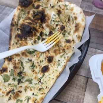 Orange Curry - Garlic Naan - Indian Near Me - Orange, California Orange Curry - Garlic Naan - Indian Near Me - Orange, California
